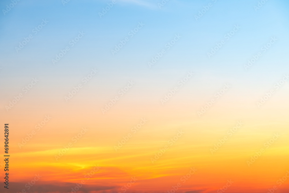 Beautiful of luxury soft gradient orange gold clouds and sunlight on the blue sky perfect for the background, take in everning,Twilight Beautiful of luxury soft gradient orange gold clouds and sunlight on the blue sky perfect for the background, take in everning,Twilight
