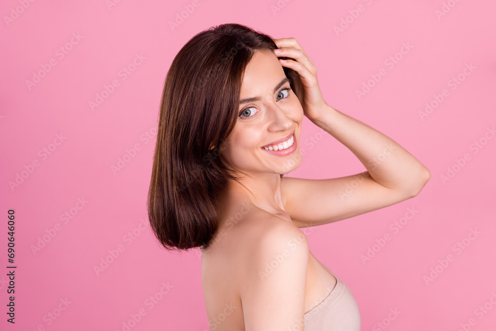 Photo of pretty attractive lady touch hairstyle enjoy prepare for party in beauty salon isolated on pastel color background Photo of pretty attractive lady touch hairstyle enjoy prepare for party in beauty salon isolated on pastel color background