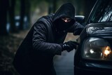 car thief breaking into a parked car and stealing valuables