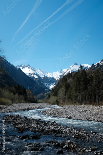 mountain river with mountains in the backkground