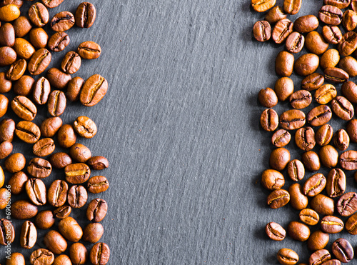 coffee beans on a grey stone board, copy space