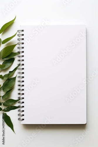 A blank notebook on a table isolated on white background