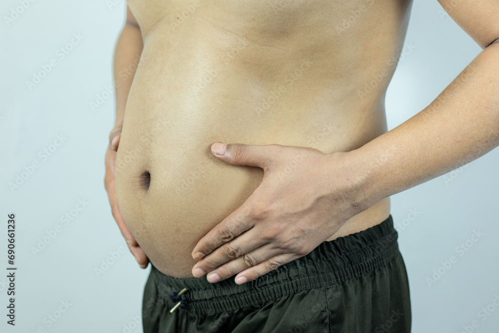 Naklejka premium Men with pot bellies or belly fat. Close-up of body parts