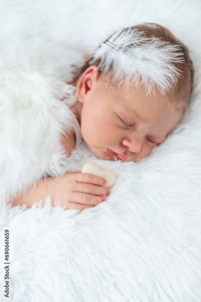 Newborn angel photo session in a suit. Selective focus Newborn angel photo session in a suit. Selective focus