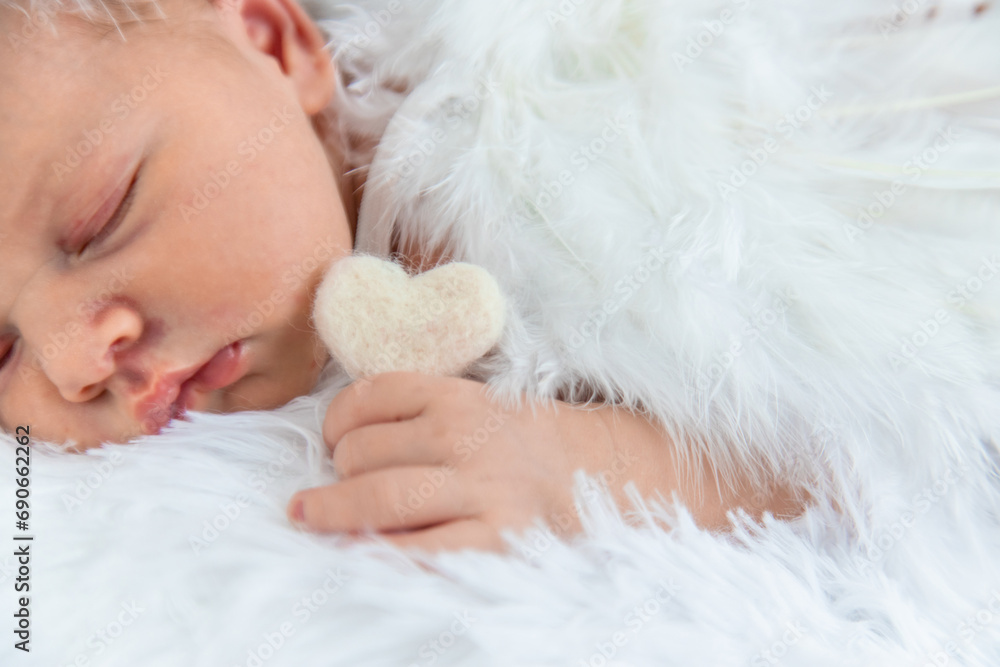 Newborn angel photo session in a suit. Selective focus Newborn angel photo session in a suit. Selective focus