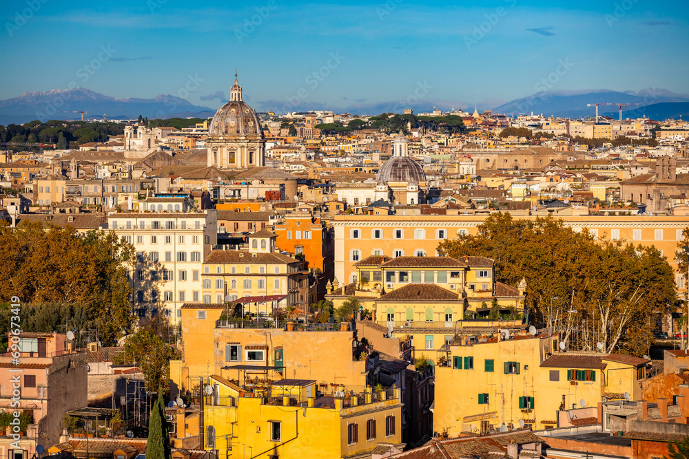 Gorgeous aerial view of the city center in Rome at sunny sunset