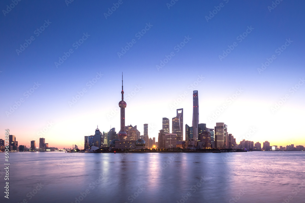 Shanghai skyline and cityscape at sunrise.