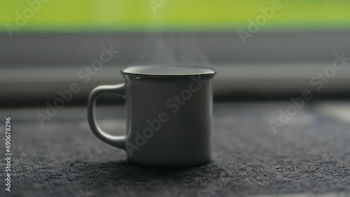 Hot coffee mug in the morning. Delicious drink to start the day. Steaming hot beverage.