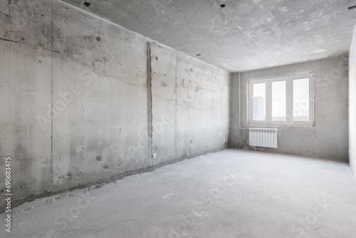 interior of the apartment without decoration in gray colors. rough finish