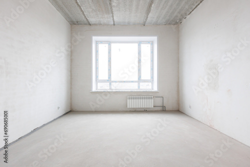 interior of the apartment without decoration in gray colors. rough finish