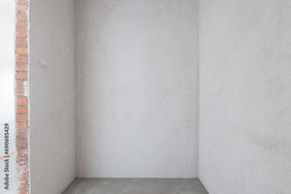 interior of the apartment without decoration in gray colors. rough finish interior of the apartment without decoration in gray colors. rough finish