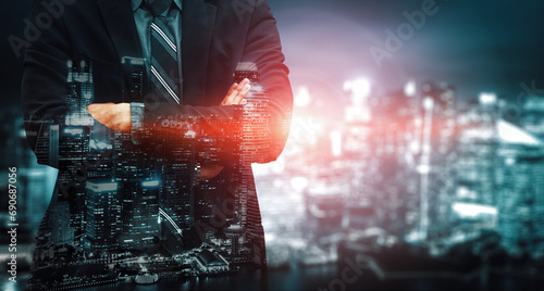 Double Exposure Image of Business Person on modern city background. Future business and communication technology concept. Surreal futuristic cityscape and abstract multiple exposure interface. uds