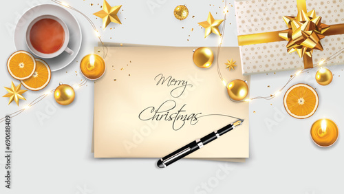 Top View of Merry Christmas lettering on paper sheet with inkpen. Realistic vector christmas object composition  photo