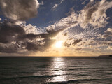 Beautiful Mediterranean warm sunset seascape with clouds, golden blue and purple 