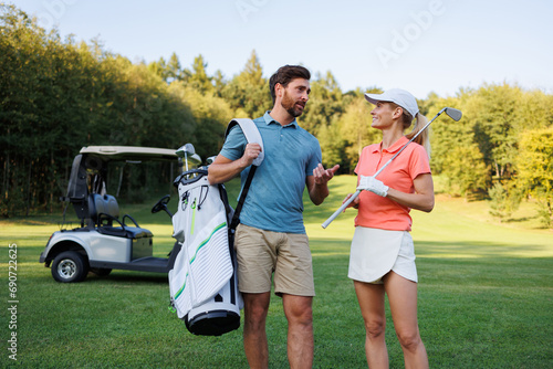 Golfing Leisure: Young Couple with Clubs and Cart