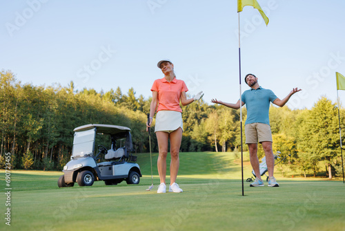 Golf Disappointment: Couple by Last Hole