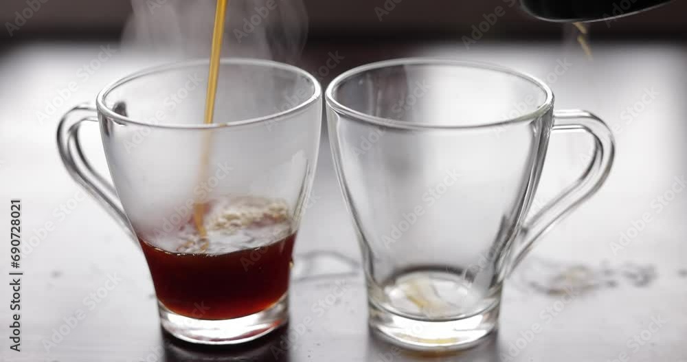 Pouring coffee into a two transparent cups, audio included Pouring coffee into a two transparent cups, audio included