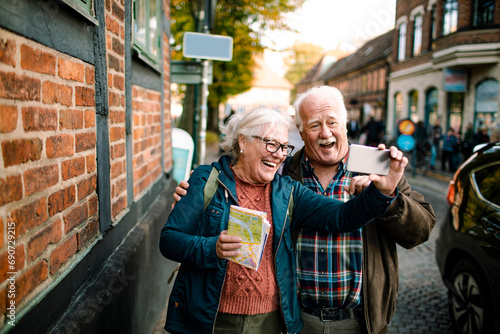 Senior Couple Taking a Selfie on a City Adventure photo