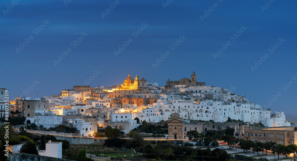 view of the white city of Ostuni just before sunrise
