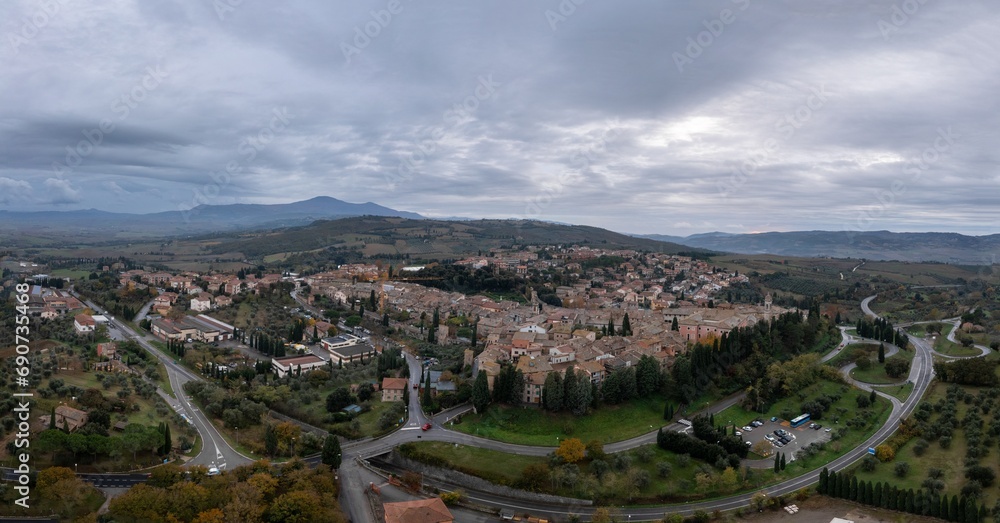 drone view of the Tuscan hilltop village and viticulture town of San Quirico d'Orcia