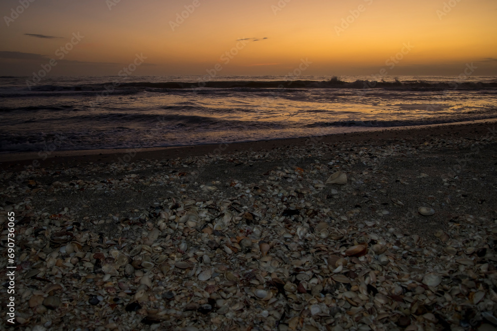 Sunset on the sea shell filled beach of Sanibel Island. Sunset on the sea shell filled beach of Sanibel Island.