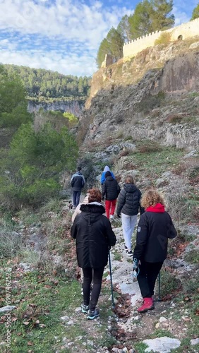 A group of adult and adolescent hikers, trekking in Alarcon, Cuenca, Spain. photo