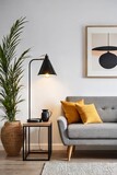 Close up of lamp on side table near sofa. Scandinavian home interior design of modern living room.