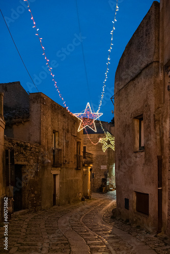 A characteristic alley with Christmas lights in the medieval town of Erice, Sicily 