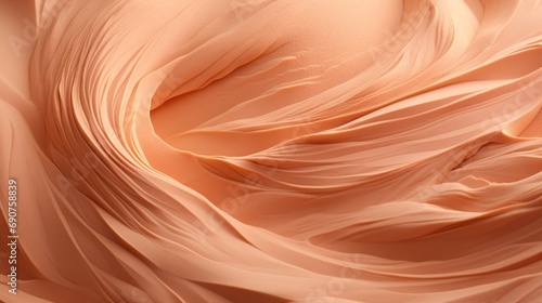 Soft waves of satin fabric in a Peach Fuzz 2024 shade create a sense of gentle movement and subtle elegance.