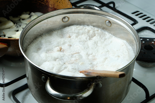 Foam from cooking chicken. Boiling water in a pan