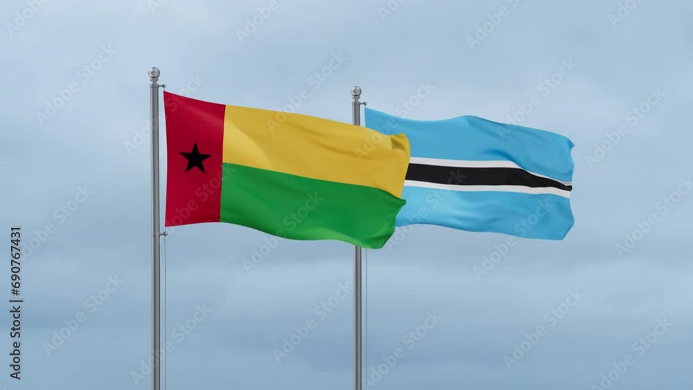 Botswana flag and Guinea-Bissau flag waving together on cloudy sky, endless seamless loop, two country relations concept Botswana flag and Guinea-Bissau flag waving together on cloudy sky, endless seamless loop, two country relations concept