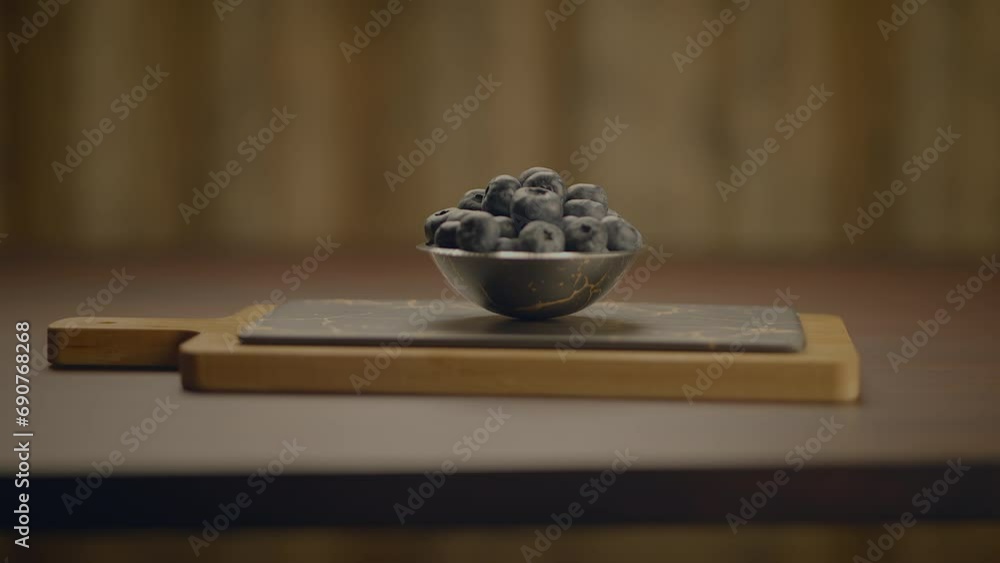 Fresh Ripe Raspberries and Blueberries Standing on Wooden Table Fresh Ripe Raspberries and Blueberries Standing on Wooden Table