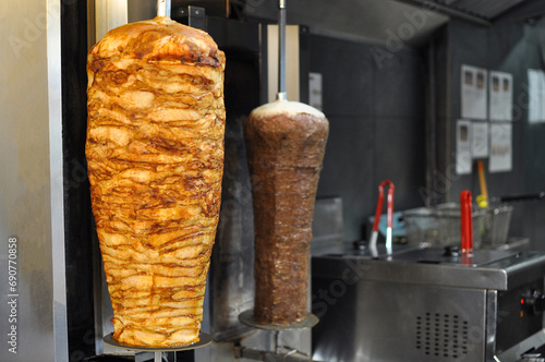 Shawarma is being cooked on a rotisserie. Chicken kebab.