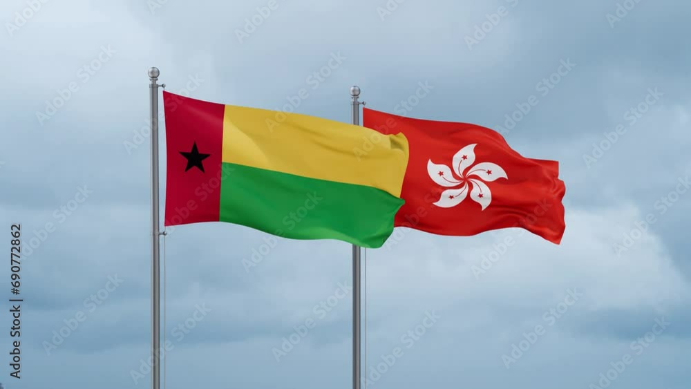 Hong Kong flag and Guinea-Bissau flag waving together on cloudy sky, endless seamless loop, two country relations concept Hong Kong flag and Guinea-Bissau flag waving together on cloudy sky, endless seamless loop, two country relations concept