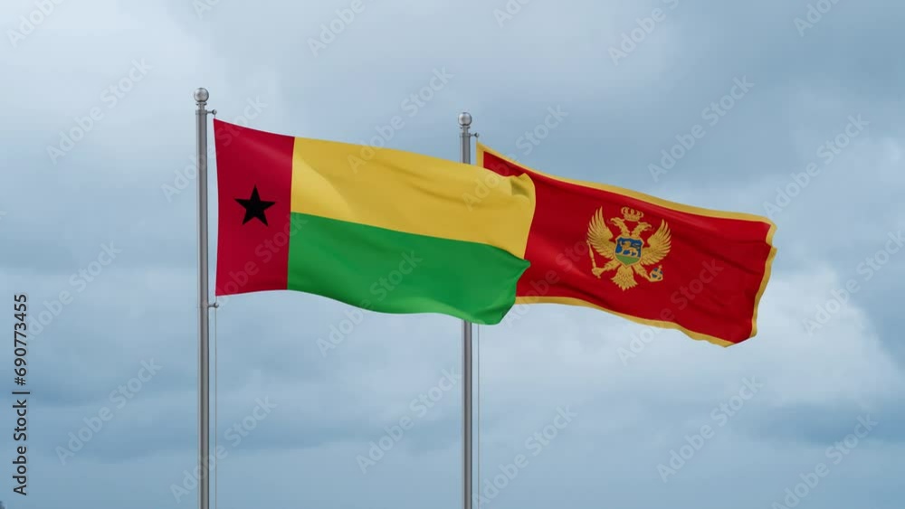 Montenegro and Guinea-Bissau flag waving together on cloudy sky, endless seamless loop, two country cooperation concept Montenegro and Guinea-Bissau flag waving together on cloudy sky, endless seamless loop, two country cooperation concept