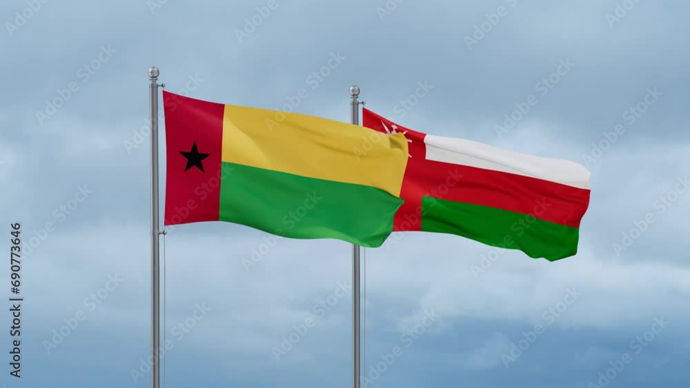 Oman and Guinea-Bissau flag waving together on cloudy sky, endless seamless loop, two country cooperation concept Oman and Guinea-Bissau flag waving together on cloudy sky, endless seamless loop, two country cooperation concept