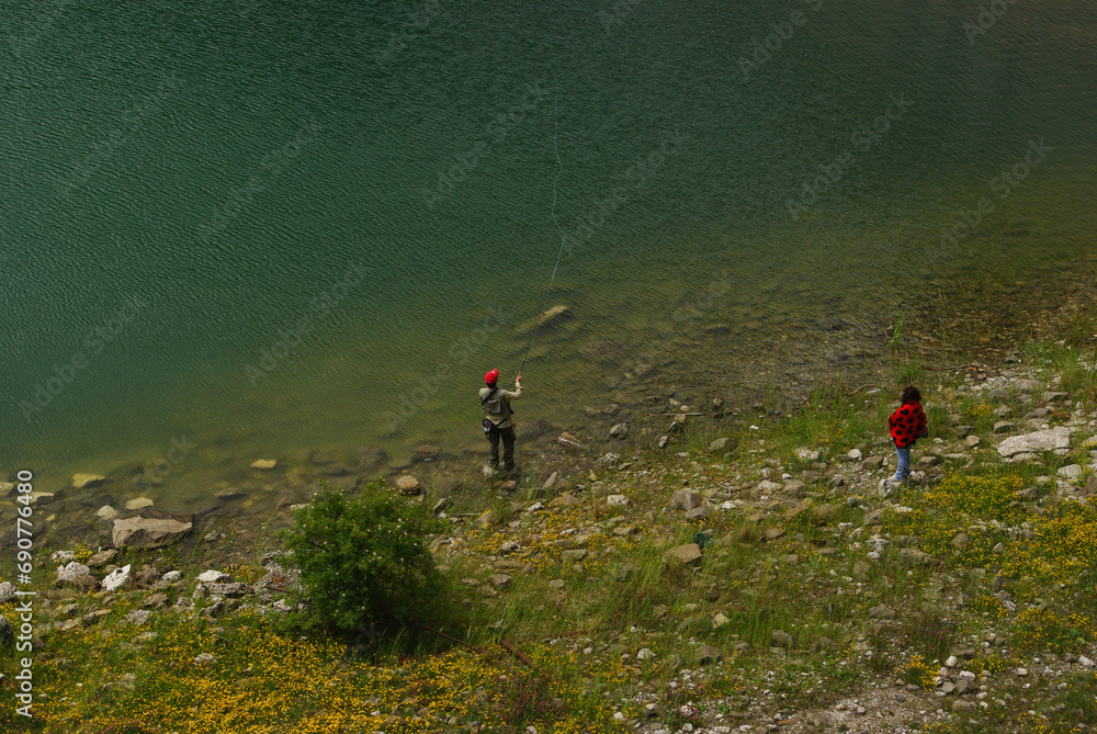 Fototapeta premium Fishing in Campotosto lake. Abruzzo, Italy