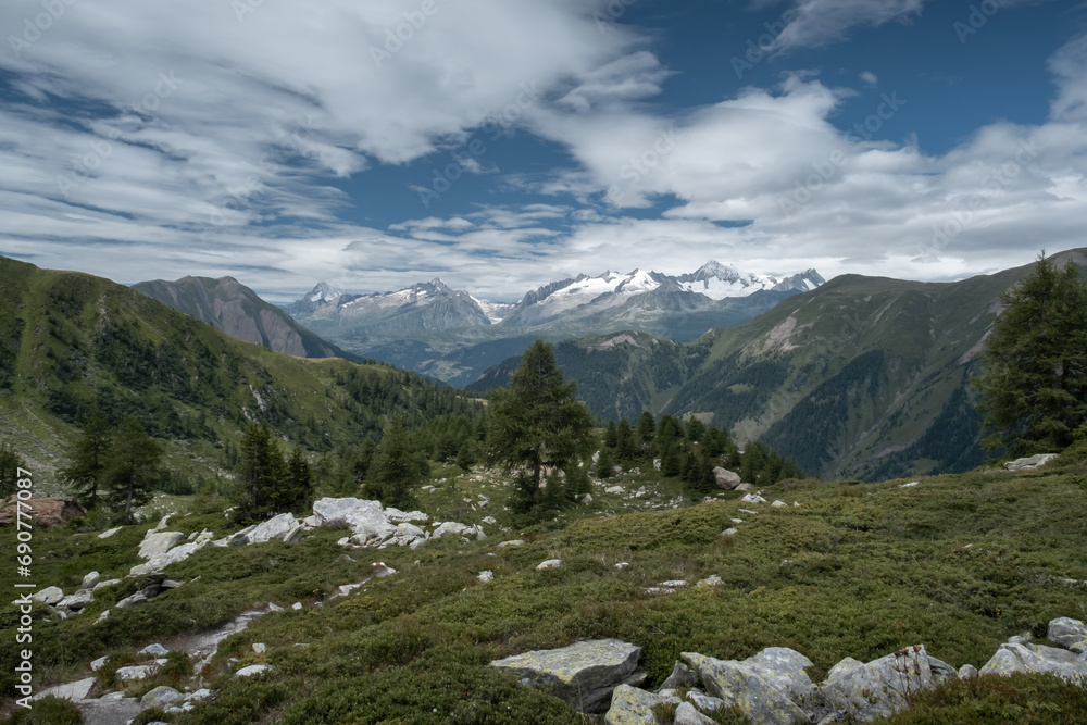 Enjoy a hike in the mountains to admire summits and glaciers in the Alps
