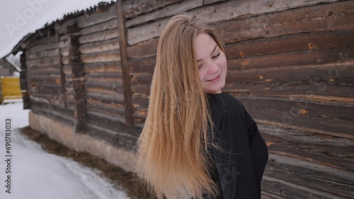 A young schoolgirl with no cues poses in winter. © Довидович Михаил