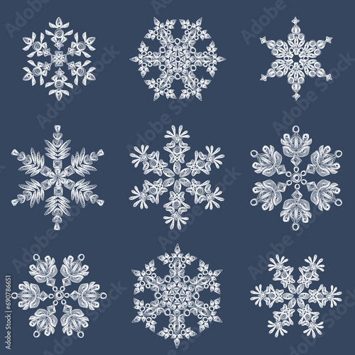 A set of stylish white quilling snowflakes on a dark blue background. Paper openwork weaving technique. Elements of quilling. New Year's symbols in the pattern.