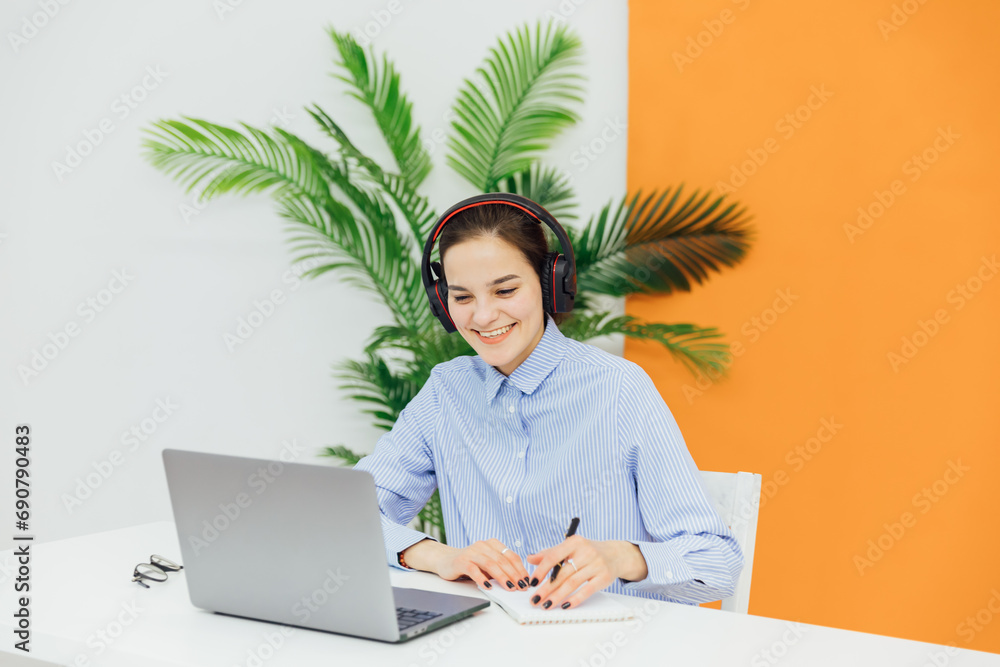 Woman on laptop online financial business from office Woman on laptop online financial business from office