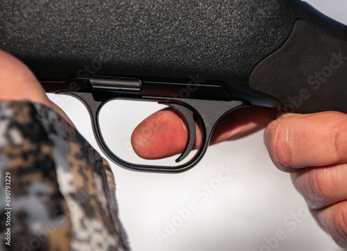 Картината върху платно Shooter's index finger is on the trigger of handgun.