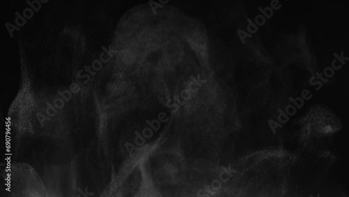 White steam from hot food or drink. White steam on a black background rises to the top. Cooking a hot meal in the kitchen. photo