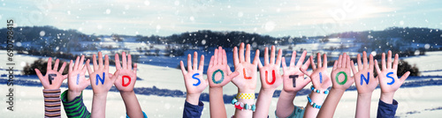 Children Hands Building Word Find Solutions, Winter Background photo