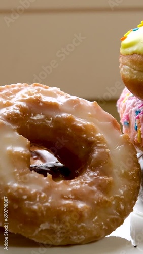 Modern bakery with different kinds of bread, cakes and buns, Assortment of bakery goods, doughnuts in bakery shop the girl takes a bun or croissant from the shop window with tongs. High quality photo