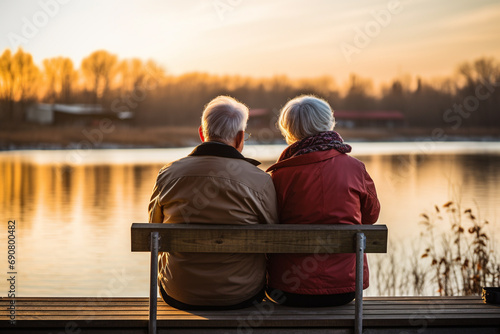 Old grandmother and grandfather, grandparents, grandma amd grandpa look at sunset. pensioners retirees senor and senorita happy sad old age.