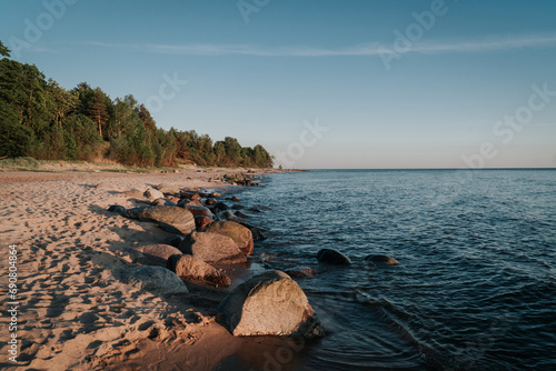 Tranquil Scene of a Peaceful Beach at Dusk with a Calm Ocean and Beautiful Reflection