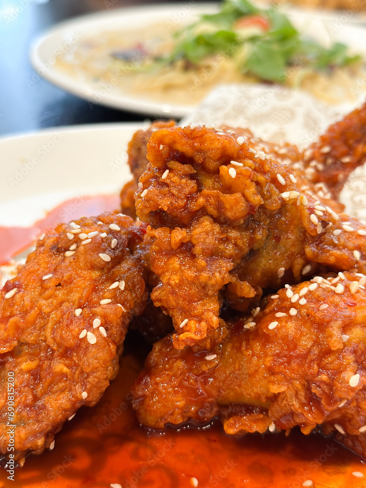 Close up of crispy fried chicken with sweet chilli sauce Close up of crispy fried chicken with sweet chilli sauce