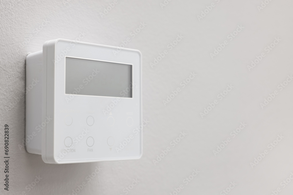 One thermostat on white wall, space for text. Smart home system One thermostat on white wall, space for text. Smart home system