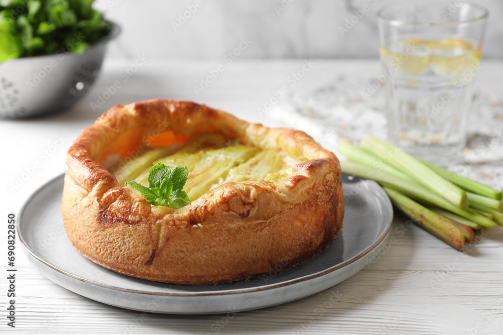 Freshly baked rhubarb pie on white wooden table Freshly baked rhubarb pie on white wooden table
